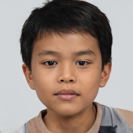 Neutral asian child male with short  brown hair and brown eyes