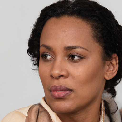 Neutral latino young-adult female with short  black hair and brown eyes