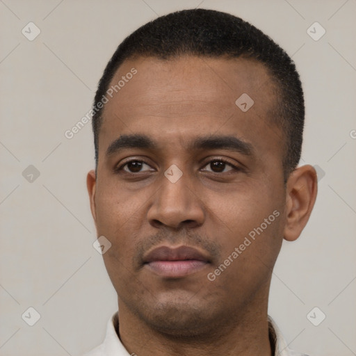 Neutral latino young-adult male with short  black hair and brown eyes