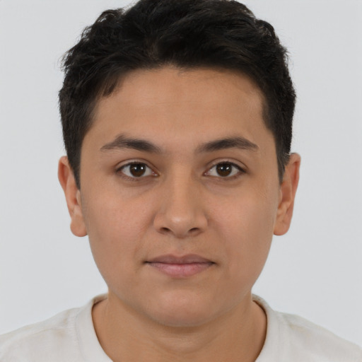 Joyful latino young-adult male with short  brown hair and brown eyes
