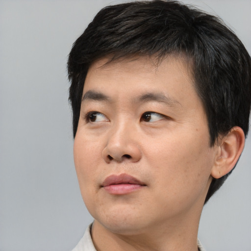 Neutral asian young-adult male with short  black hair and brown eyes