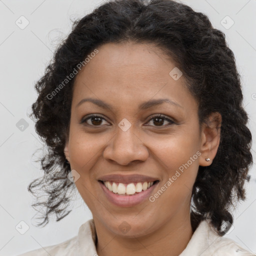 Joyful black young-adult female with medium  brown hair and brown eyes