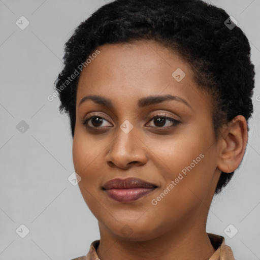 Joyful black young-adult female with short  black hair and brown eyes