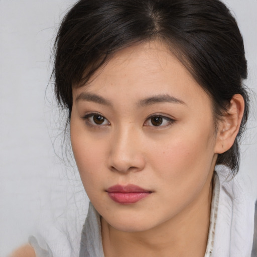 Neutral asian young-adult female with medium  brown hair and brown eyes