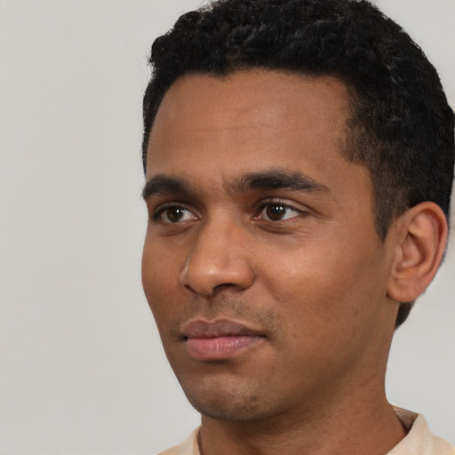 Neutral latino young-adult male with short  black hair and brown eyes
