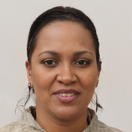 Joyful black adult female with short  brown hair and brown eyes