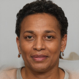 Joyful black adult female with short  brown hair and brown eyes