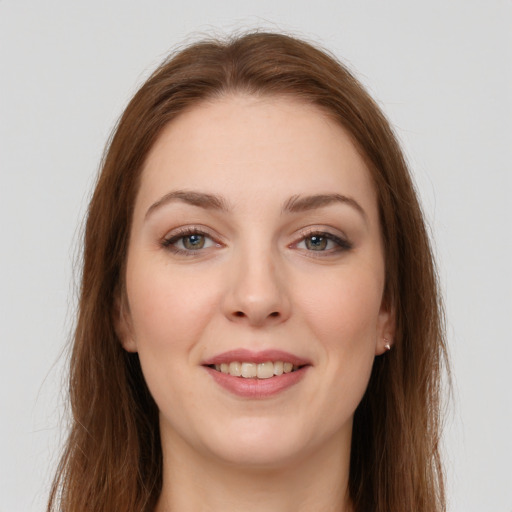 Joyful white young-adult female with long  brown hair and grey eyes