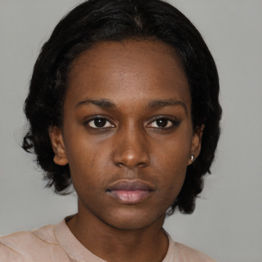 Neutral black young-adult female with medium  black hair and brown eyes