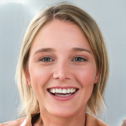 Joyful white young-adult female with medium  brown hair and blue eyes