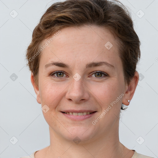 Joyful white young-adult female with short  brown hair and grey eyes