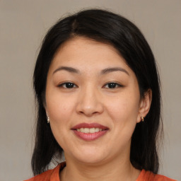 Joyful asian young-adult female with medium  black hair and brown eyes