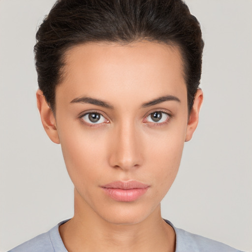 Neutral white young-adult female with short  brown hair and brown eyes