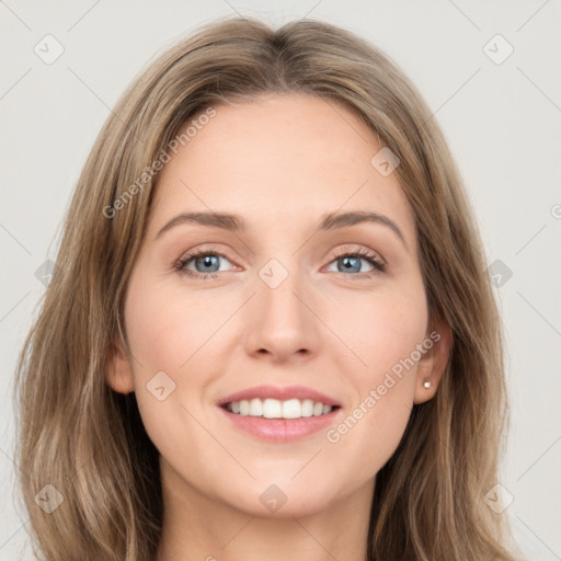 Joyful white young-adult female with long  brown hair and grey eyes