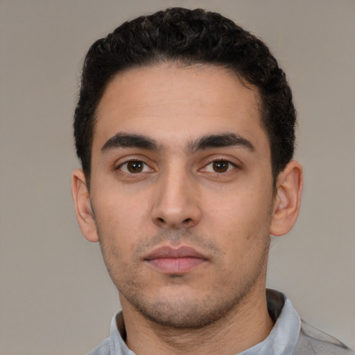Neutral white young-adult male with short  black hair and brown eyes