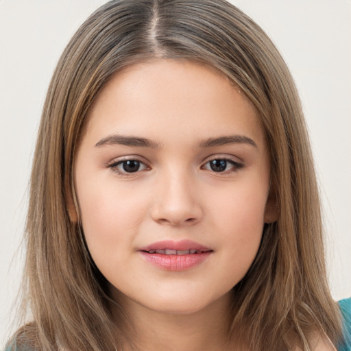 Joyful white child female with long  brown hair and brown eyes