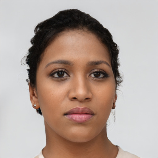 Neutral latino young-adult female with short  brown hair and brown eyes