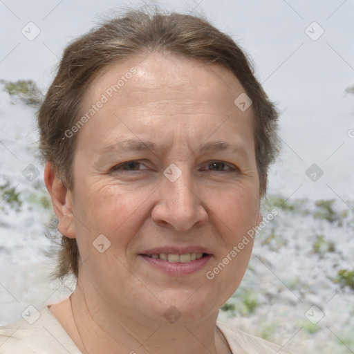 Joyful white adult female with medium  brown hair and brown eyes