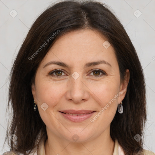 Joyful white adult female with medium  brown hair and brown eyes