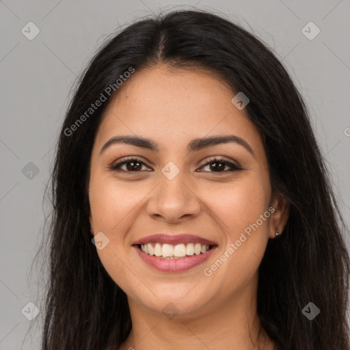 Joyful latino young-adult female with long  brown hair and brown eyes