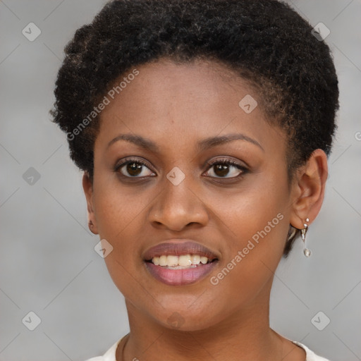 Joyful black young-adult female with short  brown hair and brown eyes