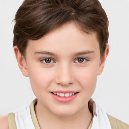 Joyful white child female with short  brown hair and brown eyes