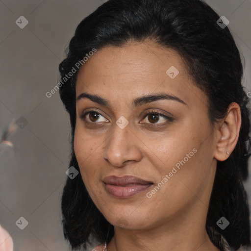 Joyful latino young-adult female with long  brown hair and brown eyes