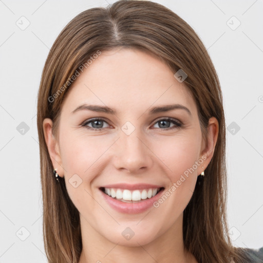 Joyful white young-adult female with long  brown hair and grey eyes