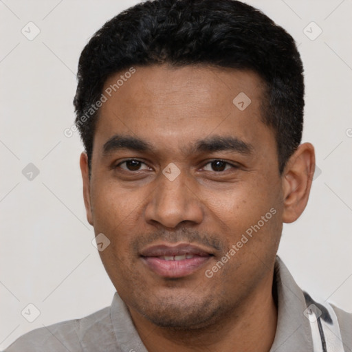 Joyful latino young-adult male with short  black hair and brown eyes