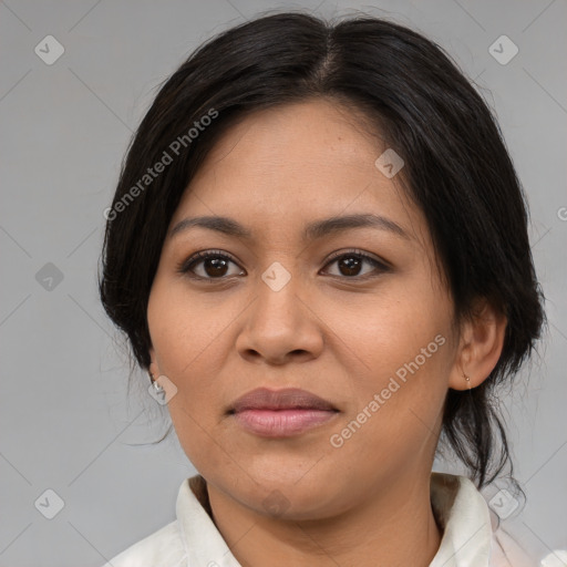 Joyful latino young-adult female with medium  brown hair and brown eyes