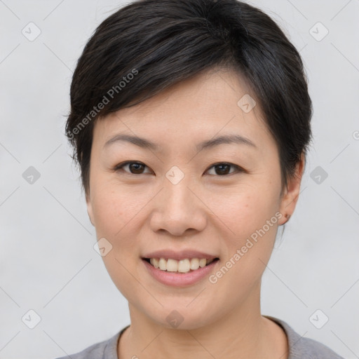 Joyful asian young-adult female with short  brown hair and brown eyes