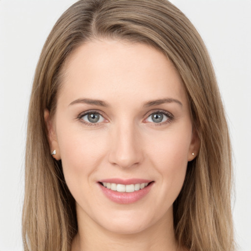 Joyful white young-adult female with long  brown hair and grey eyes