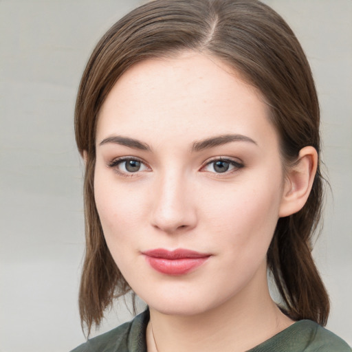 Neutral white young-adult female with medium  brown hair and grey eyes