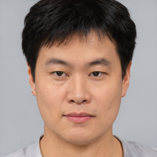 Neutral asian young-adult male with short  brown hair and brown eyes