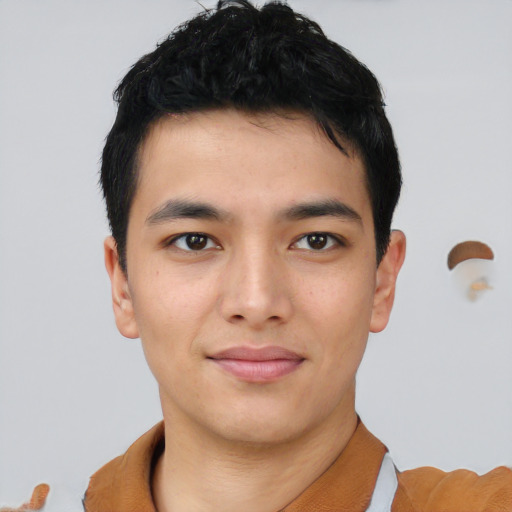 Joyful asian young-adult male with short  black hair and brown eyes