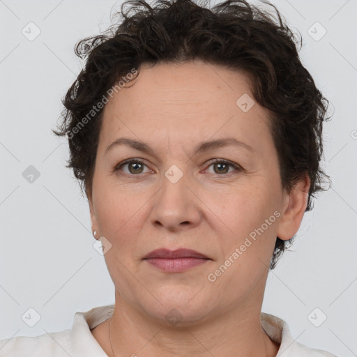 Joyful white adult female with short  brown hair and brown eyes