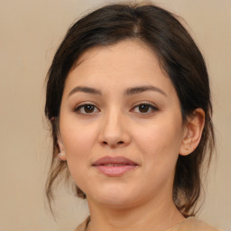 Joyful white young-adult female with medium  brown hair and brown eyes