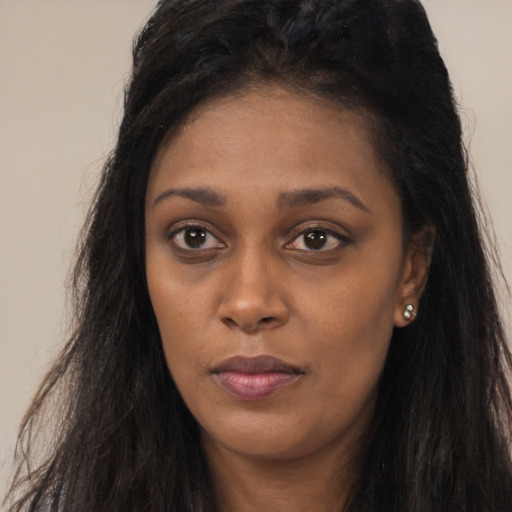 Neutral latino young-adult female with long  black hair and brown eyes