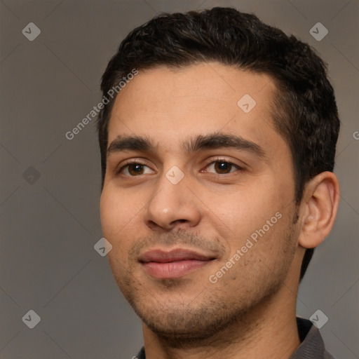 Joyful white young-adult male with short  black hair and brown eyes