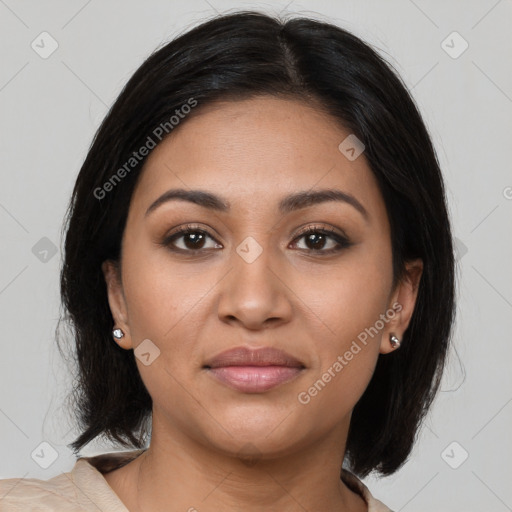 Joyful latino young-adult female with medium  brown hair and brown eyes