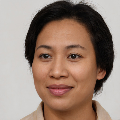 Joyful white young-adult female with medium  brown hair and brown eyes