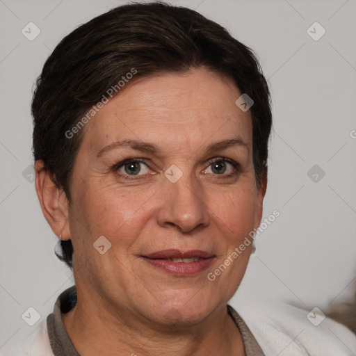 Joyful white adult female with short  brown hair and brown eyes