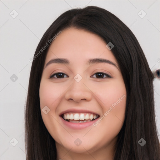 Joyful white young-adult female with long  black hair and brown eyes