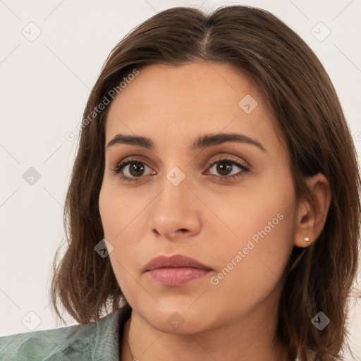 Neutral white young-adult female with long  brown hair and brown eyes