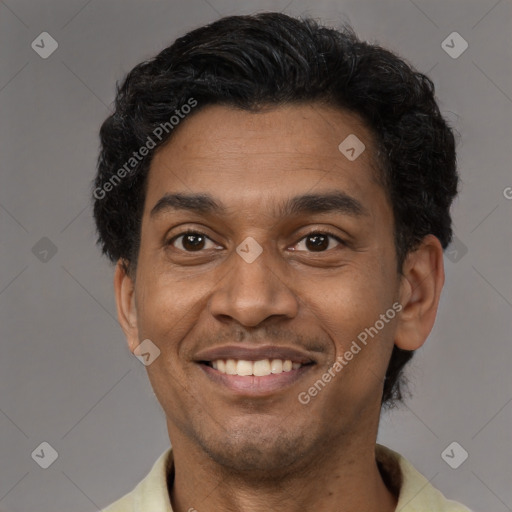 Joyful latino young-adult male with short  black hair and brown eyes