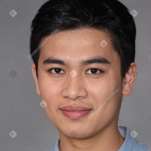 Joyful asian young-adult male with short  brown hair and brown eyes