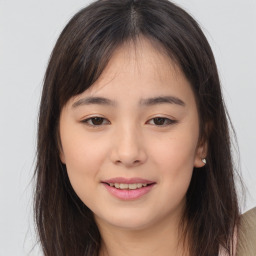 Joyful asian young-adult female with long  brown hair and brown eyes