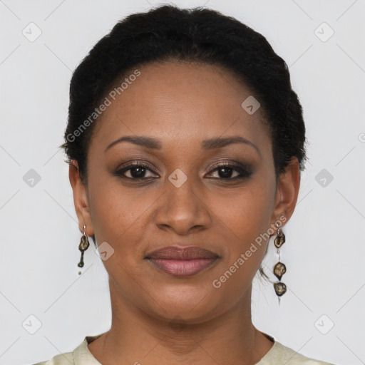 Joyful black young-adult female with short  black hair and brown eyes