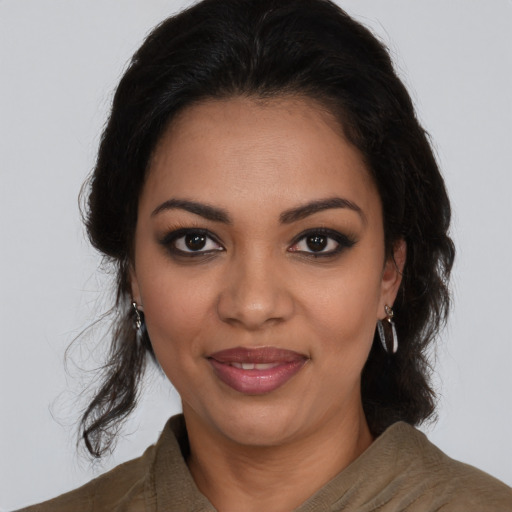 Joyful latino young-adult female with medium  brown hair and brown eyes