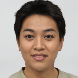 Joyful asian young-adult female with short  brown hair and brown eyes